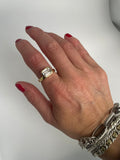 Emerald-cut cubic zirconia bezel ring worn on the hand