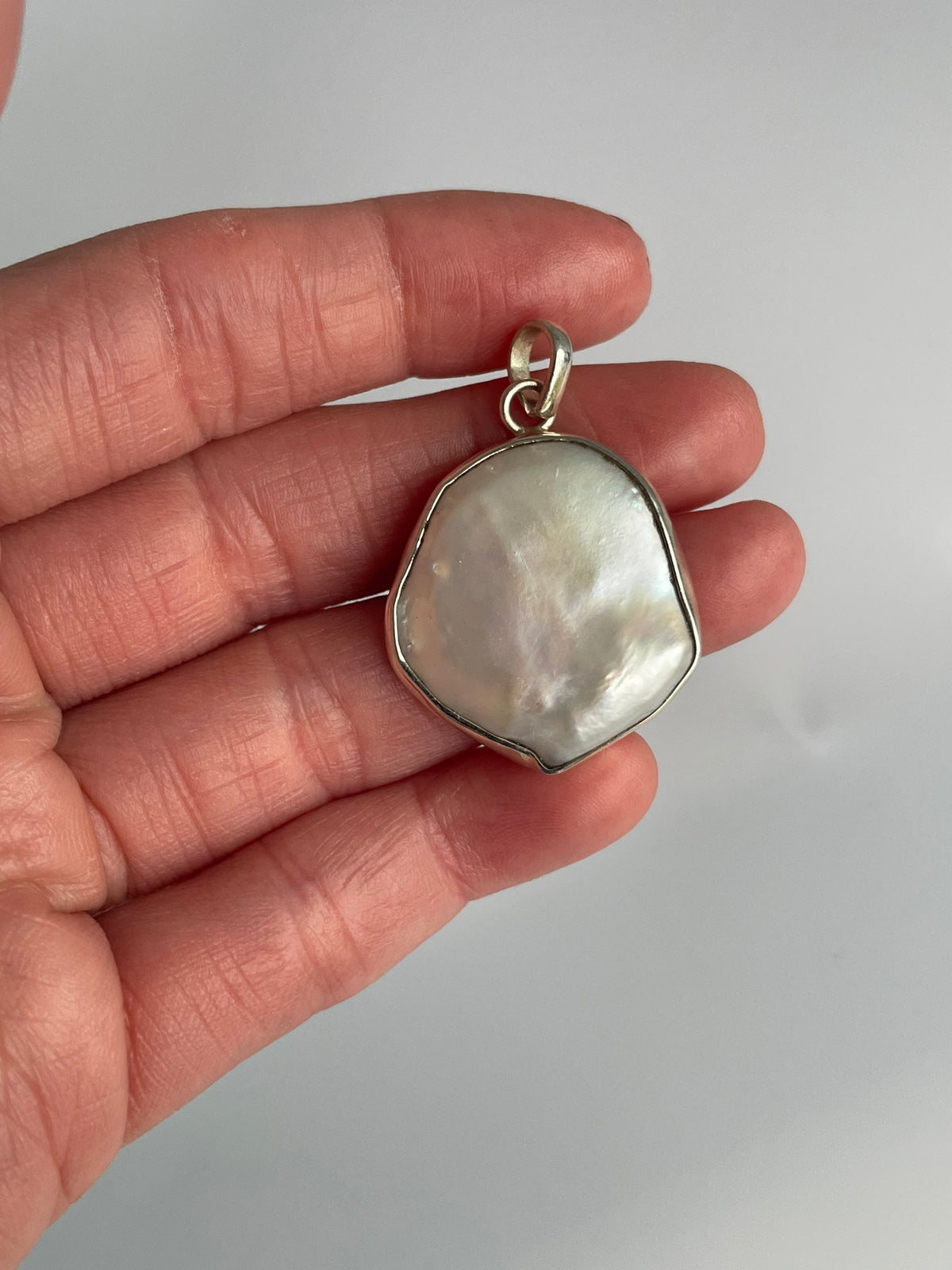Baroque pearl pendant held up by its bail