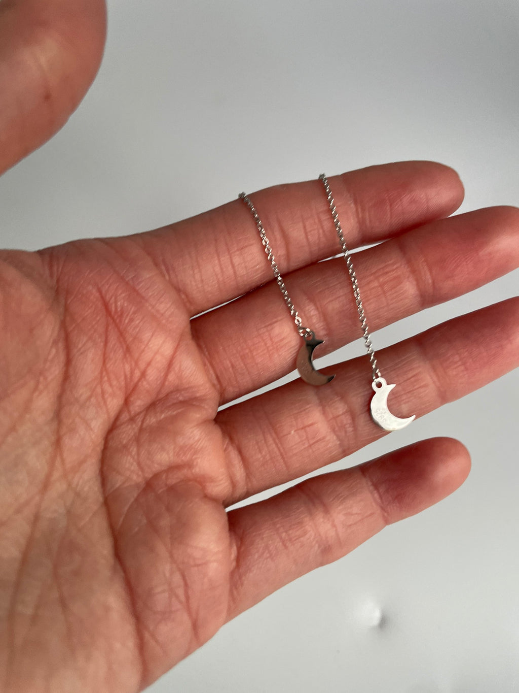 Silver chain threader earrings with polished crescent moon charms