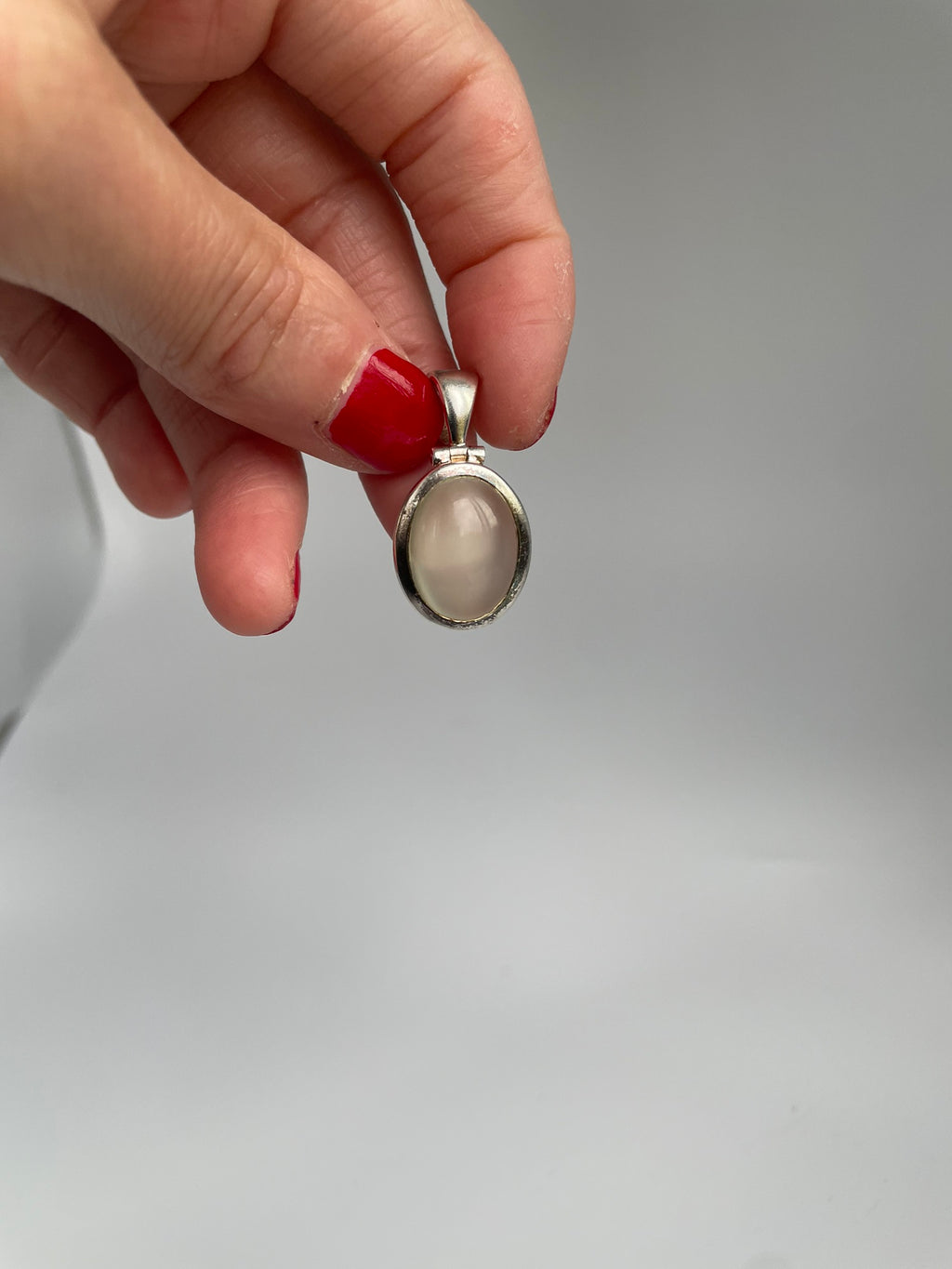 Cat's eye pendant hanging from its bail