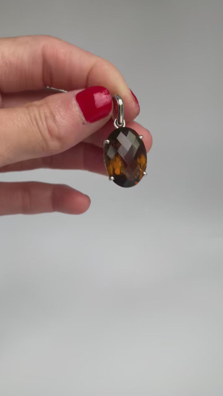 Video of the smoky faceted oval pendant catching the light